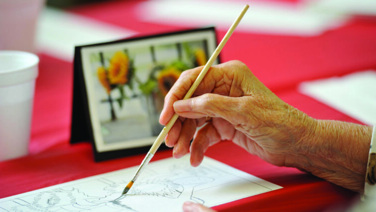 elder painting an image